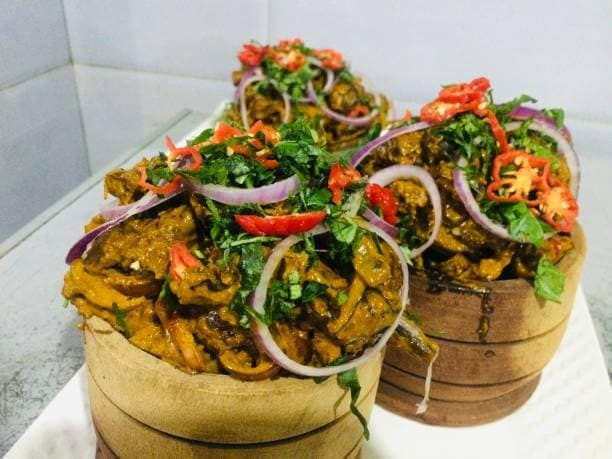 Traditional Eastern Nigerian recipe prepared with Goat meat, spices, seasonings, vegetables and palm oil Traditional Eastern Nigerian recipe prepared with Goat meat, spices, seasonings, vegetables and palm oil
