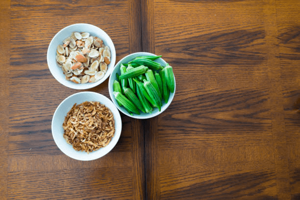 the Ogbono seeds side by side with Crayfish and Okra