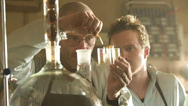 Breaking Bad, featuring actors Bryan Cranston as Walter White and Aaron Paul as Jesse Pinkman in a chemistry lab